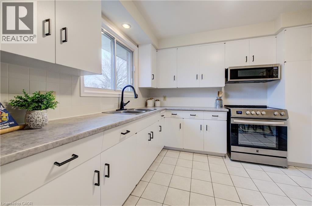 Spacious, eat-in kitchen, ample storage space, and brand new appliances. - 66 Tupper Crescent, Kitchener, ON - Indoor Photo Showing Kitchen With Double Sink