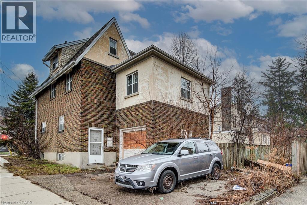 2nd driveway is off Victoria Street and offers a single car garage - 71 Margaret Avenue, Kitchener, ON - Outdoor