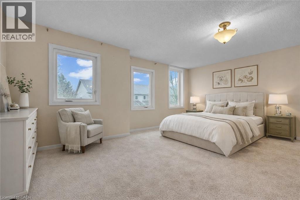 Bedroom with a textured ceiling and light colored carpet - 26 Roehampton Crescent, Guelph, ON - Indoor Photo Showing Bedroom
