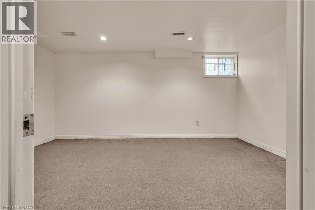 Spare room with light carpet and recessed lighting - 26 Roehampton Crescent, Guelph, ON - Indoor Photo Showing Other Room