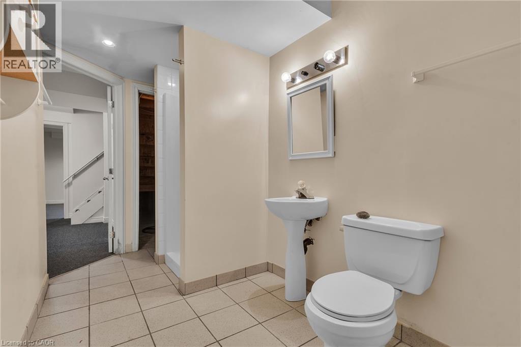 Bathroom with toilet and light tile patterned floors - 26 Roehampton Crescent, Guelph, ON - Indoor Photo Showing Bathroom