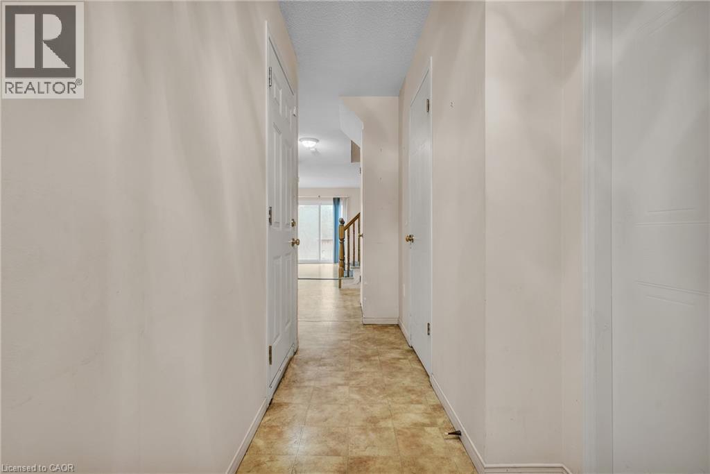 Hall with baseboards and a textured ceiling - 26 Roehampton Crescent, Guelph, ON - Indoor Photo Showing Other Room