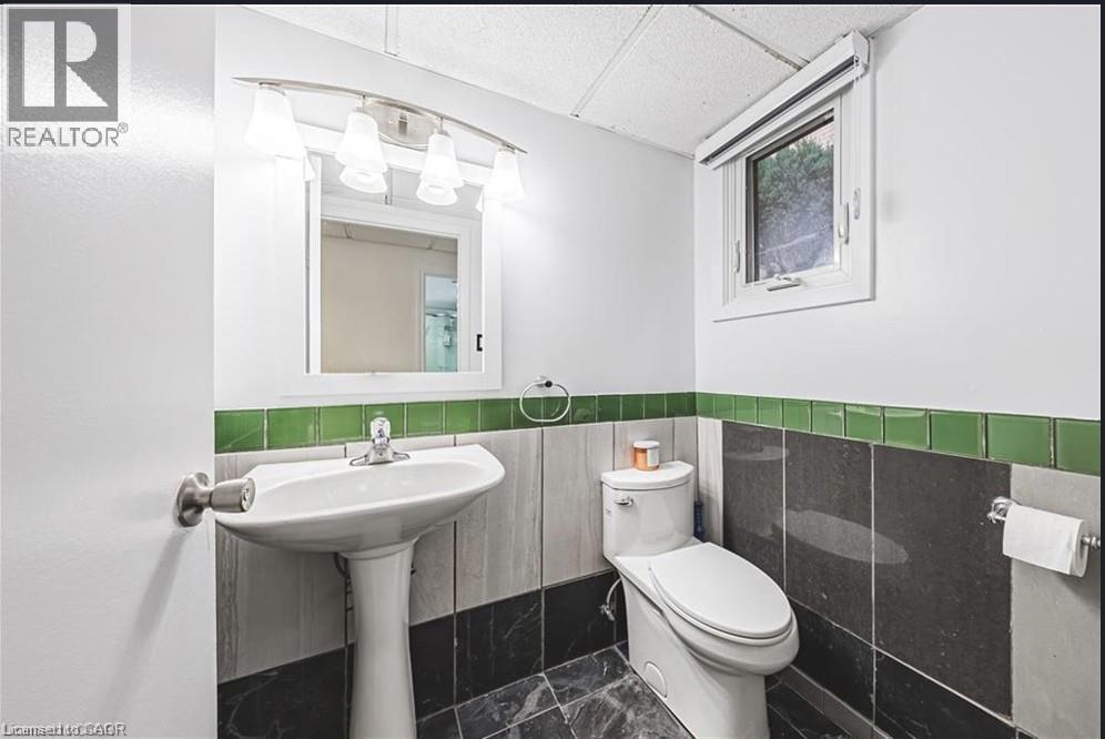 Powder room on lower level - 267 Erb Street E, Waterloo, ON - Indoor Photo Showing Bathroom