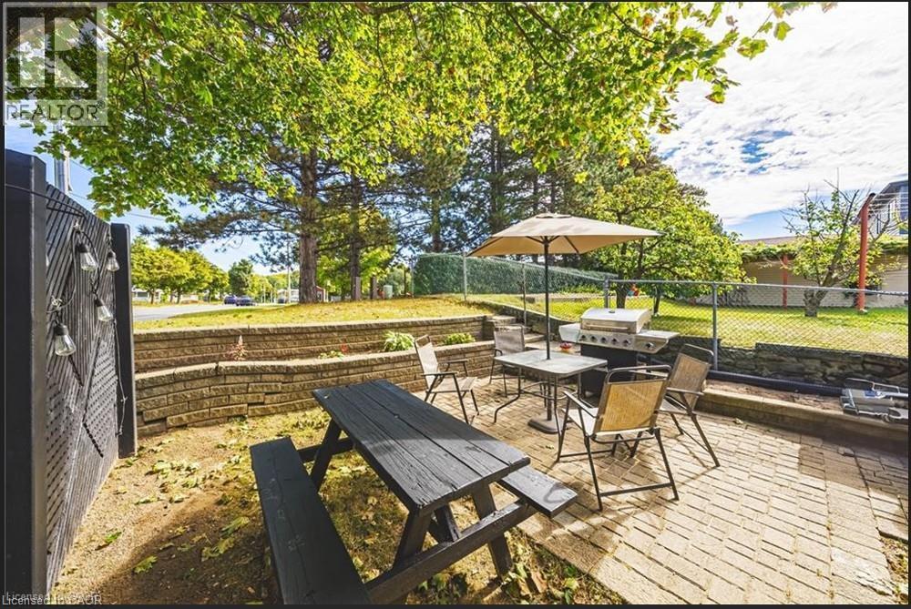 View of patio featuring outdoor dining space and area for grilling - 267 Erb Street E, Waterloo, ON - Outdoor