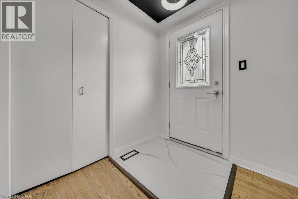 Foyer entrance featuring light wood-type flooring and baseboards - 267 Erb Street E, Waterloo, ON - Indoor Photo Showing Other Room