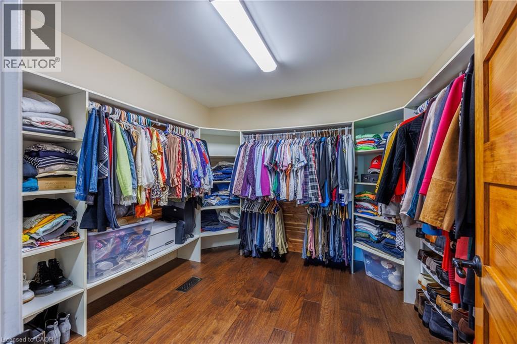 walk-in closet of primary bathroom - 1285 Cockshutt Road, Simcoe, ON - Indoor With Storage