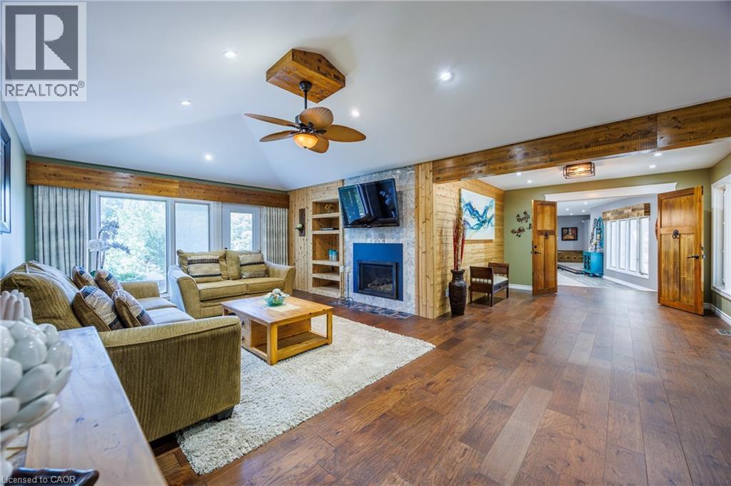 east end walk out to deck , separate entrance - 1285 Cockshutt Road, Simcoe, ON - Indoor Photo Showing Living Room With Fireplace