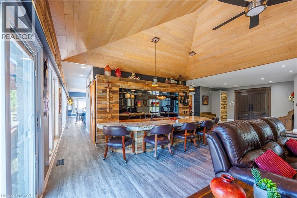 Dining area with a vaulted wooden ceiling, ceiling fan, wood finished floors, and recessed lighting - 1285 Cockshutt Road, Simcoe, ON - Indoor