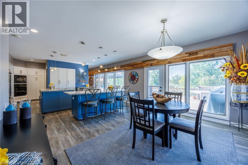 Dining area featuring dark wood-style floors and recessed lighting - 1285 Cockshutt Road, Simcoe, ON - Indoor Photo Showing Dining Room