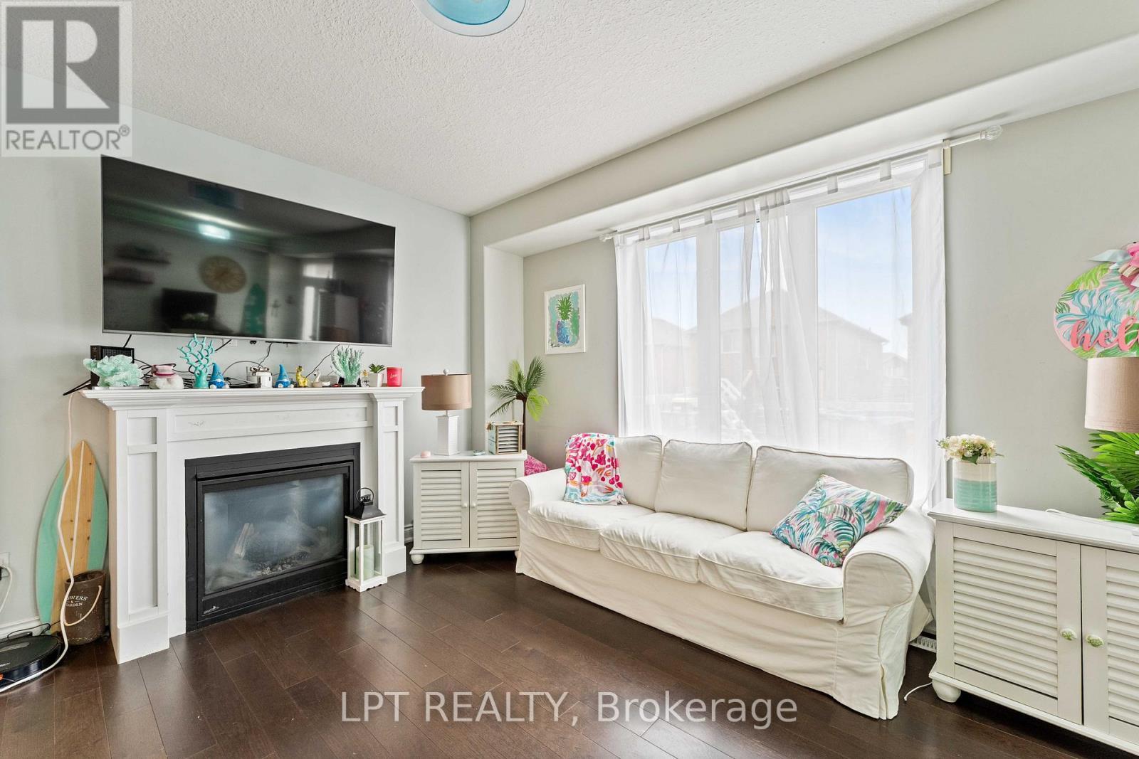 82 Nathan Crescent, Barrie, ON - Indoor Photo Showing Living Room With Fireplace