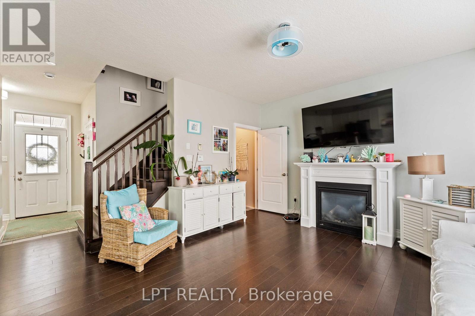82 Nathan Crescent, Barrie, ON - Indoor Photo Showing Living Room With Fireplace