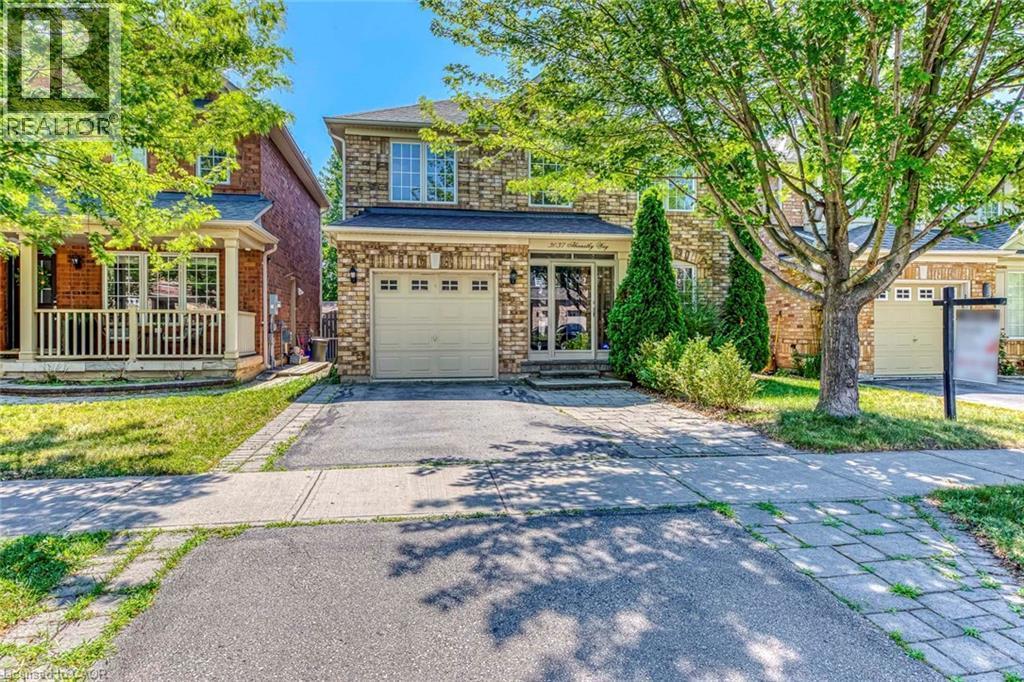 Traditional-style house with driveway and an attached garage - 3037 Abernathy Way, Oakville, ON - Outdoor