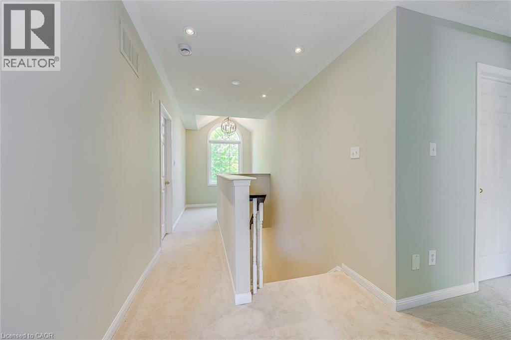 Hallway featuring an upstairs landing, light colored carpet, and recessed lighting - 3037 Abernathy Way, Oakville, ON - Indoor Photo Showing Other Room