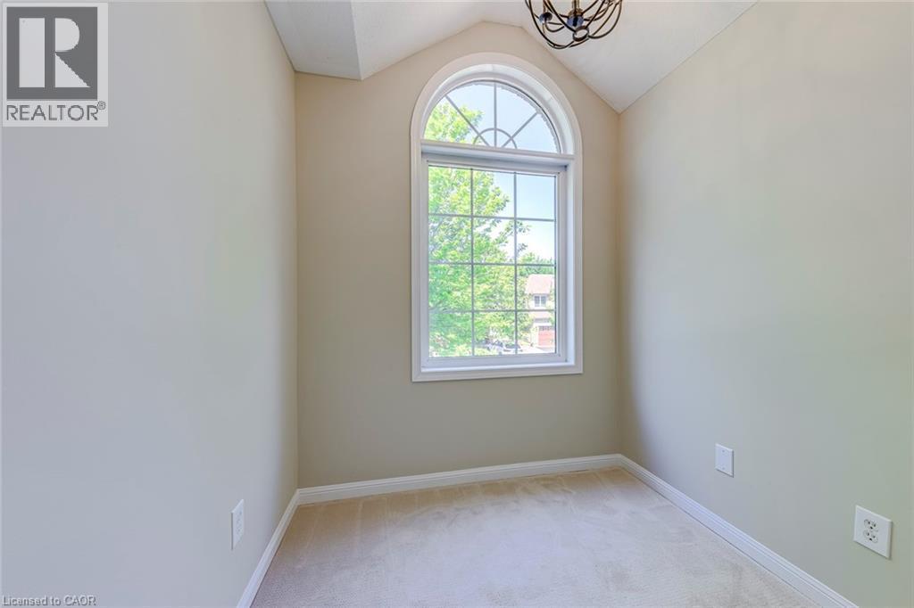 Computer Nook featuring light carpet, lofted ceiling, and suspended lighting - 3037 Abernathy Way, Oakville, ON - Indoor Photo Showing Other Room