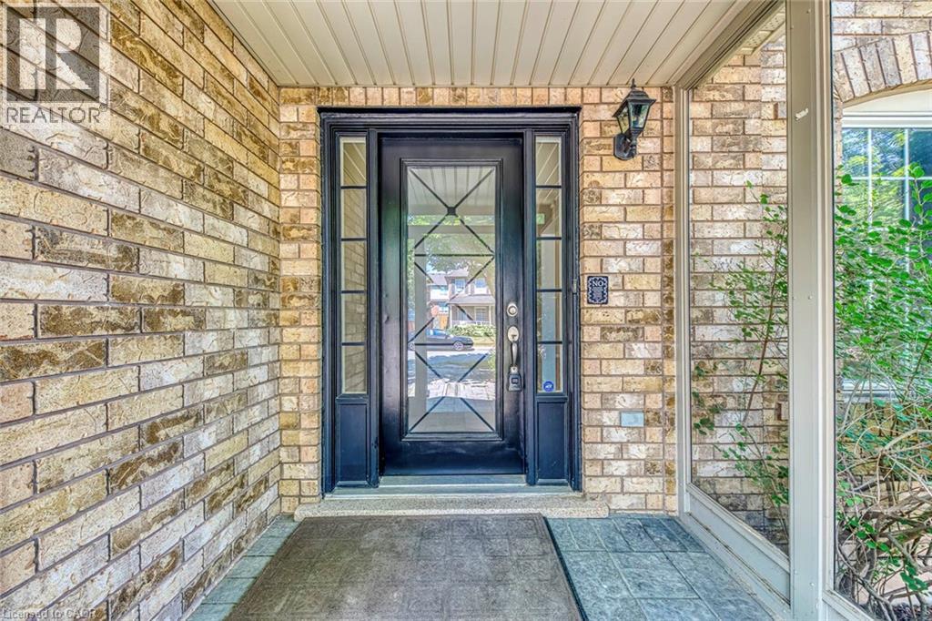 Property entrance featuring brick siding - 3037 Abernathy Way, Oakville, ON - Outdoor