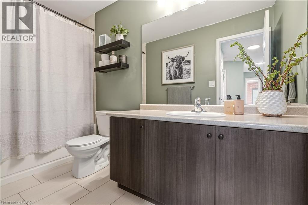 Full bath featuring vanity and shower / bathtub combination with curtain - 105 Larry Crescent, Caledonia, ON - Indoor Photo Showing Bathroom