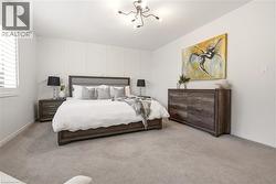 Bedroom with light colored carpet -