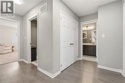 Hall featuring light wood finished floors -