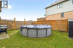 View of fenced backyard -