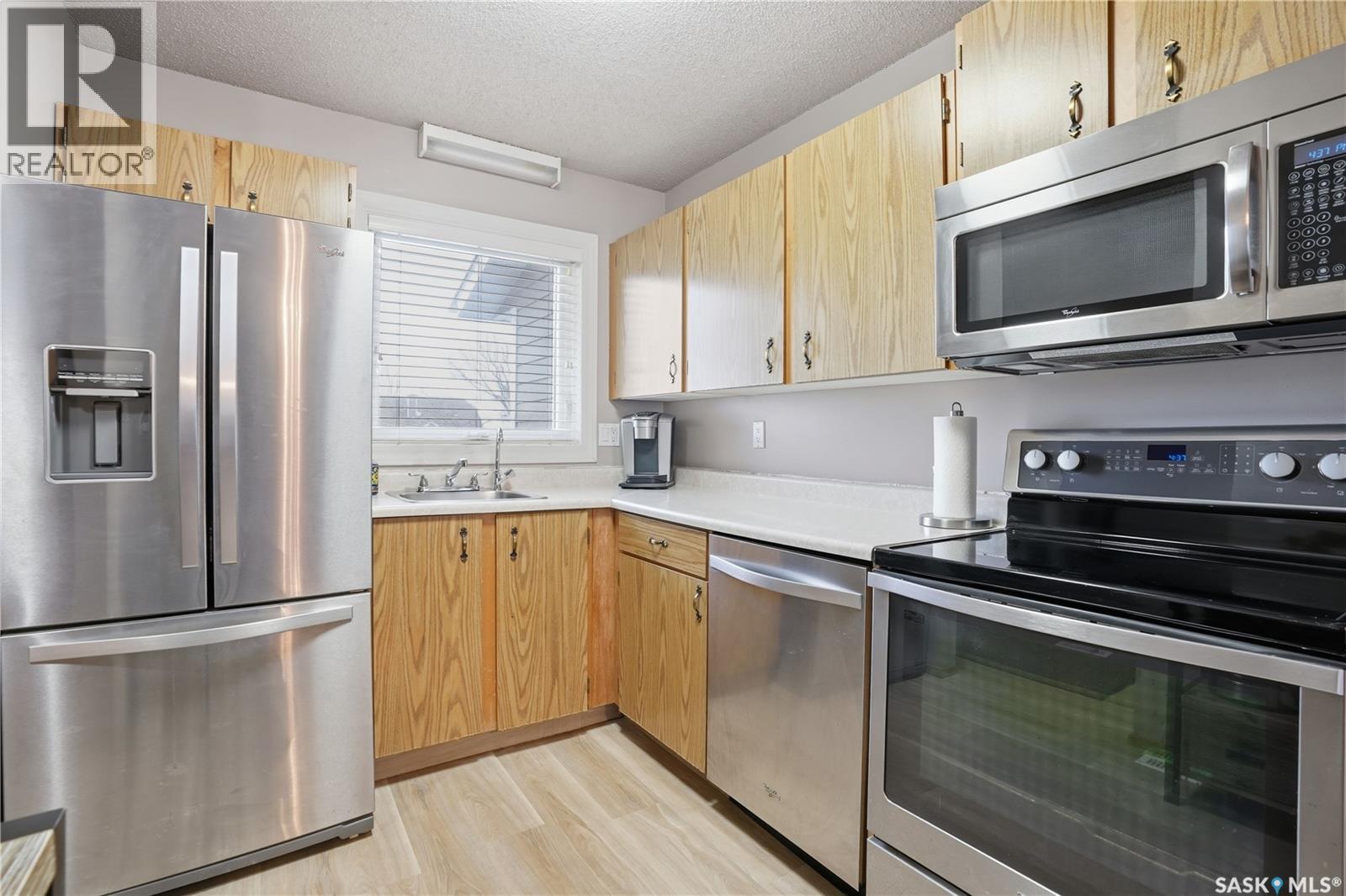 118 Cedar Meadow Drive, Regina, SK - Indoor Photo Showing Kitchen With Stainless Steel Kitchen