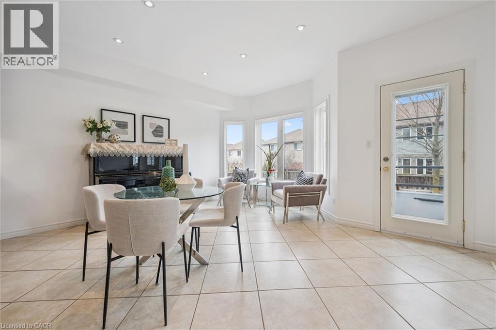 Dining room featuring recessed lighting and light tile patterned floors - 512 Wood Nettle Way, Waterloo, ON - Indoor Photo Showing Other Room