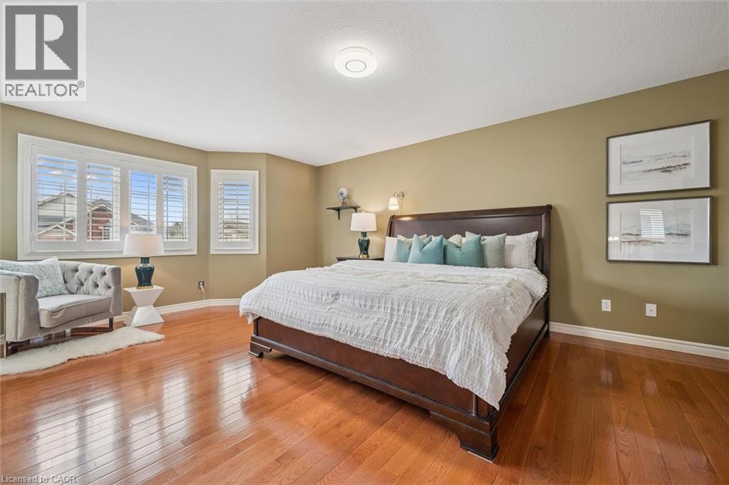 Bedroom with hardwood / wood-style floors - 512 Wood Nettle Way, Waterloo, ON - Indoor Photo Showing Bedroom