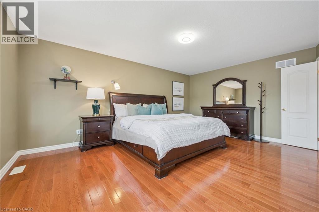 Bedroom featuring light wood-type flooring and baseboards - 512 Wood Nettle Way, Waterloo, ON - Indoor Photo Showing Bedroom
