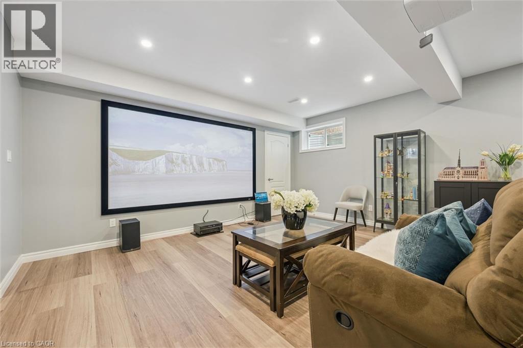 Cinema with light wood-style flooring and recessed lighting - 512 Wood Nettle Way, Waterloo, ON - Indoor Photo Showing Other Room