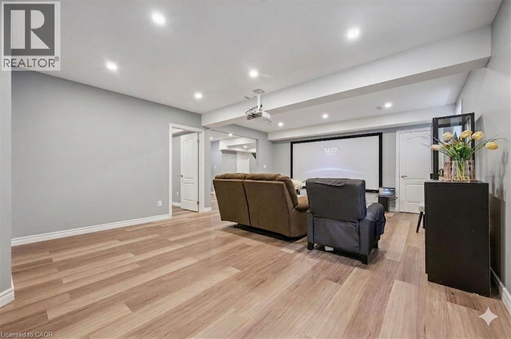 Cinema featuring light wood-style flooring and recessed lighting - 512 Wood Nettle Way, Waterloo, ON - Indoor Photo Showing Other Room