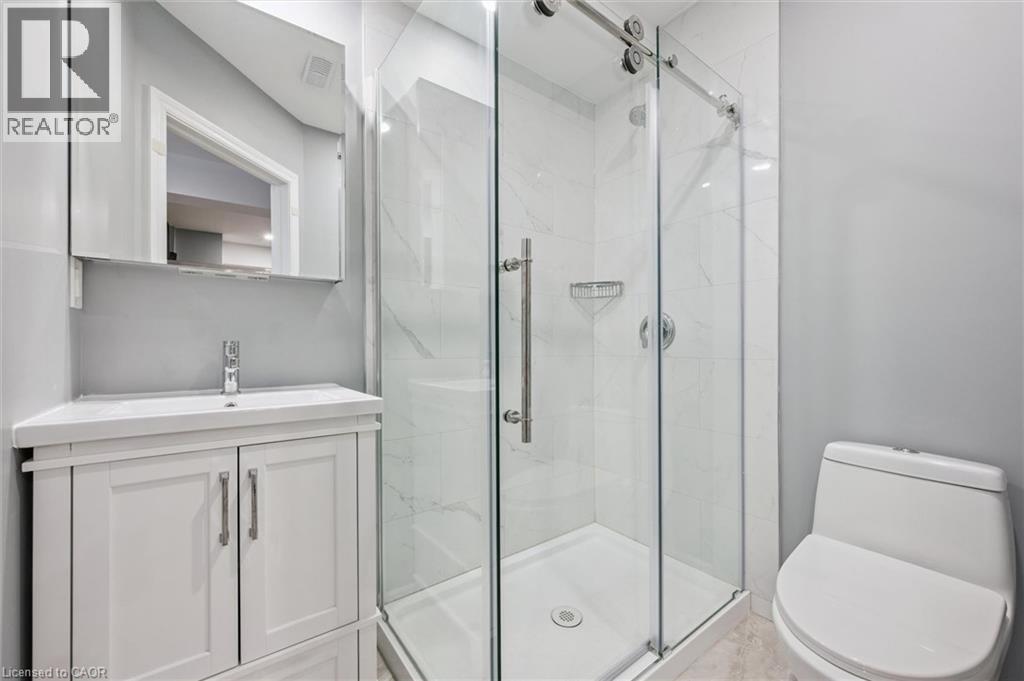 Bathroom featuring vanity and a stall shower - 512 Wood Nettle Way, Waterloo, ON - Indoor Photo Showing Bathroom