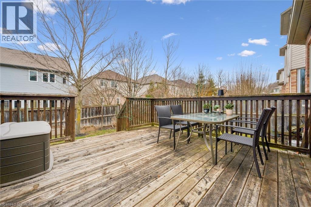 Deck with outdoor dining space and a residential view - 512 Wood Nettle Way, Waterloo, ON - Outdoor With Deck Patio Veranda With Exterior
