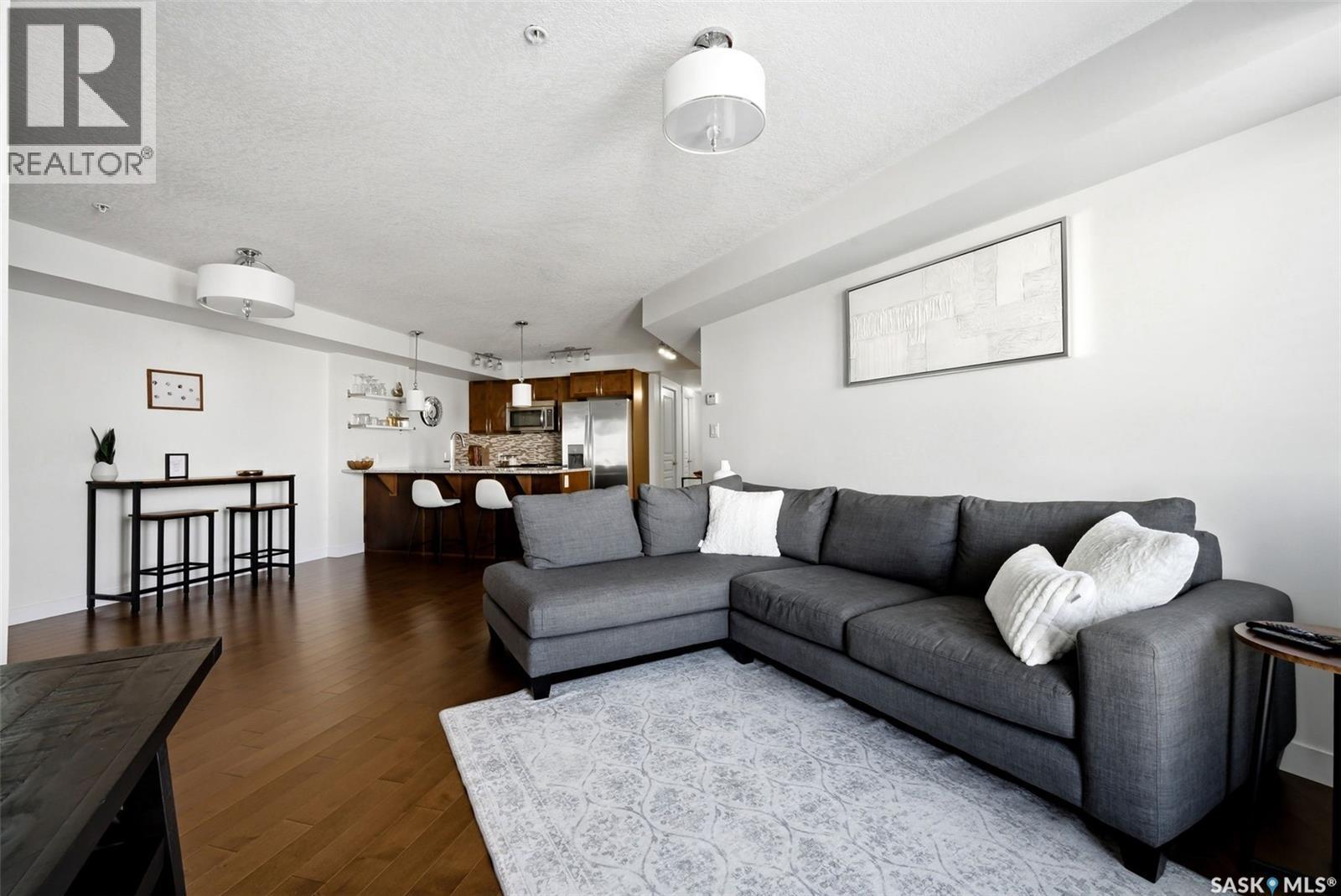 312 5301 Universal Crescent, Regina, SK - Indoor Photo Showing Living Room