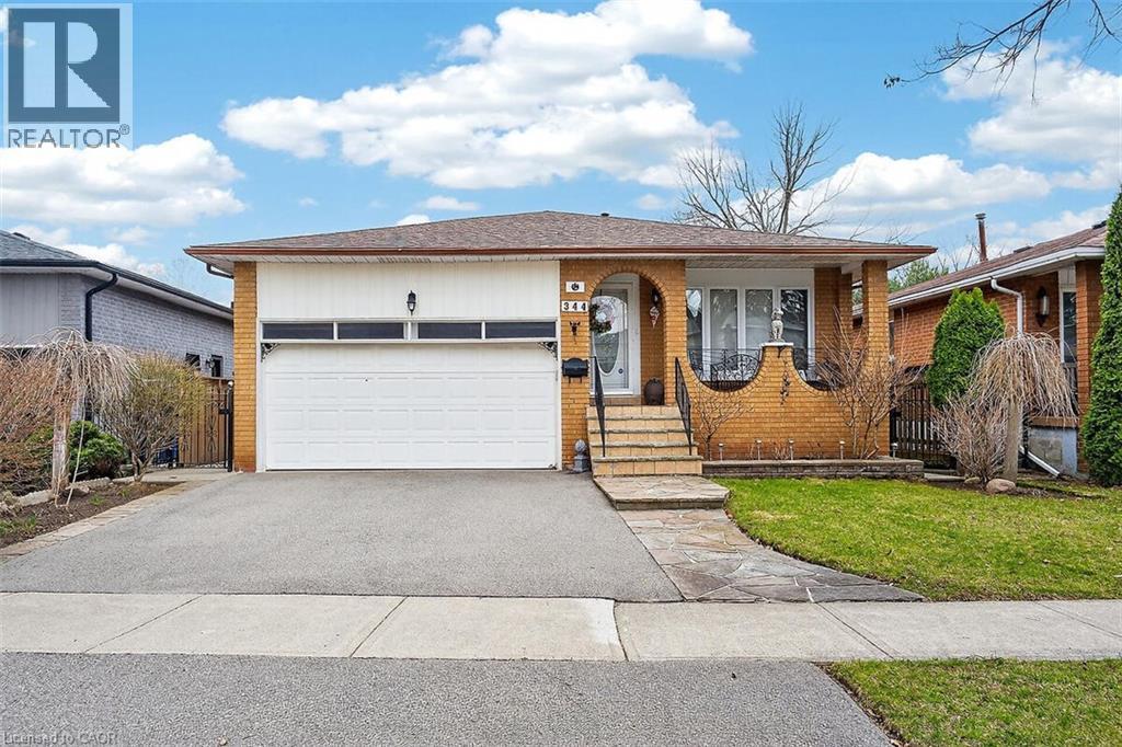 Single story home featuring brick siding, driveway, and a garage - 344 Enfield Road, Burlington, ON - Outdoor With Facade