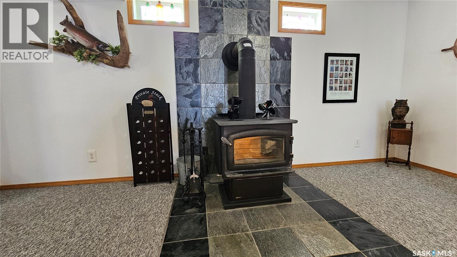 47 Ferguson Bay, Webb Rm No. 138, SK - Indoor Photo Showing Other Room With Fireplace