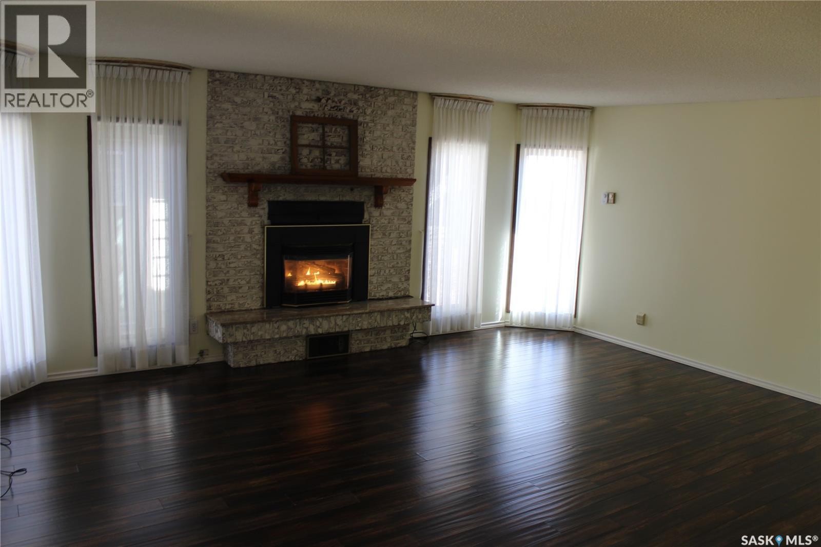 1533 Thorn Crescent, Estevan, SK - Indoor Photo Showing Living Room With Fireplace