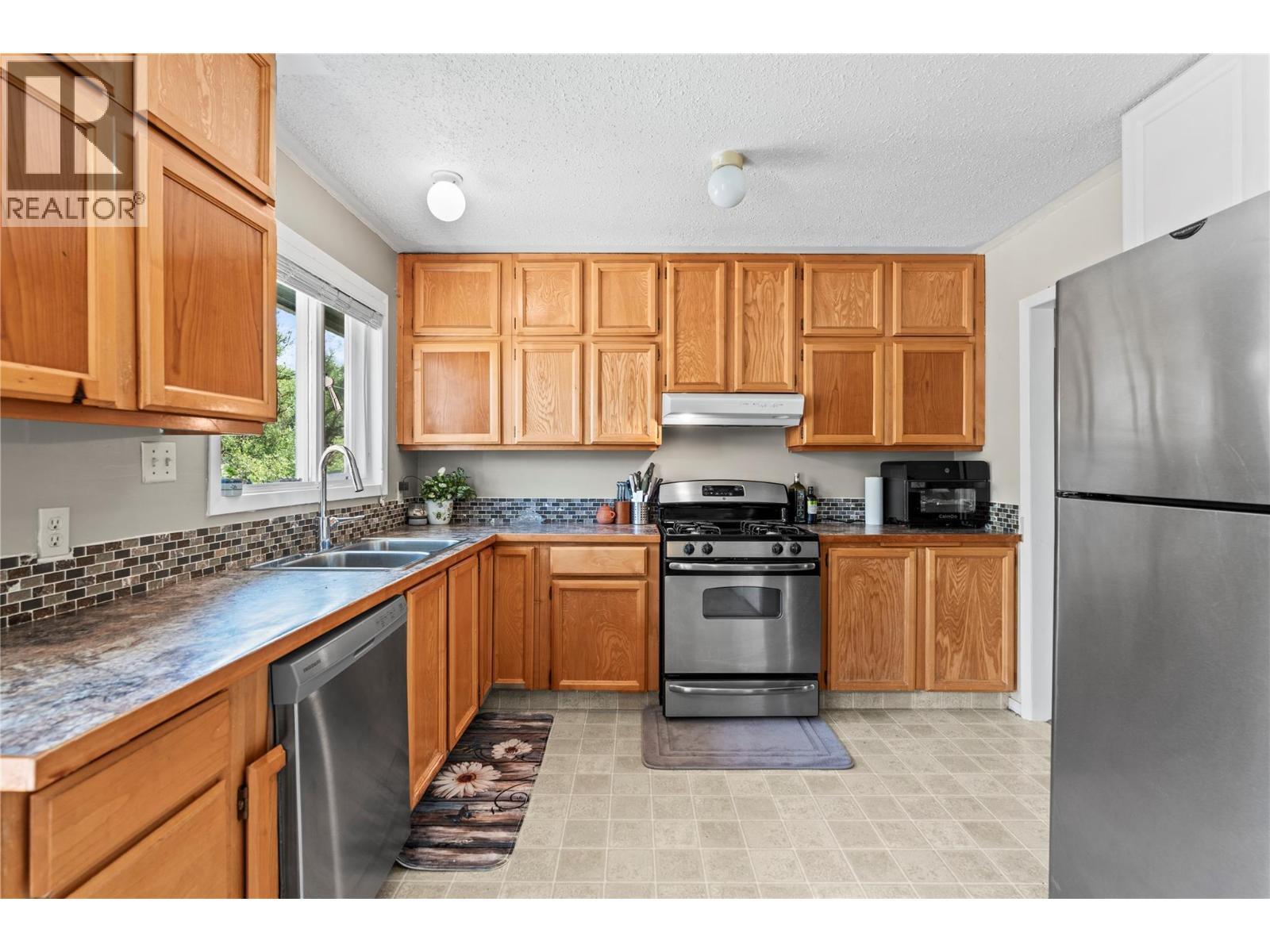 Second Home Kitchen - 1451 Mountview Road, Vernon, BC - Indoor Photo Showing Kitchen With Stainless Steel Kitchen With Double Sink