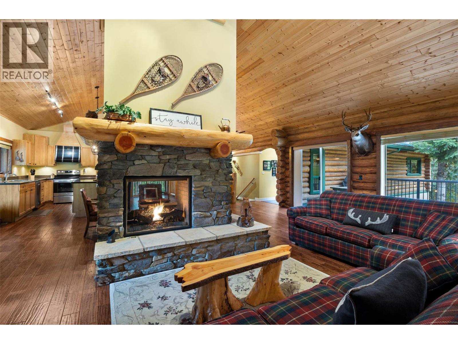 7799 Golf Course Road, Anglemont, BC - Indoor Photo Showing Living Room With Fireplace