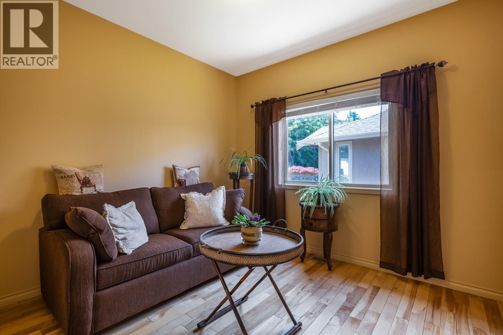 Main level bedroom #2 - 610 Arrowleaf Lane, Kelowna, BC - Indoor Photo Showing Living Room