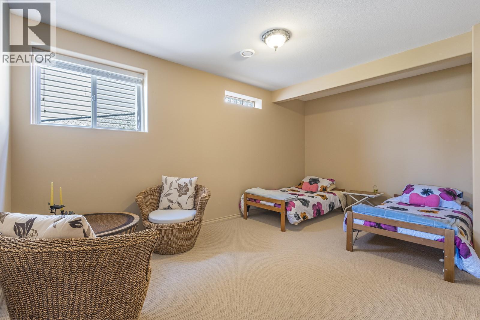 Recreation/den space on lower level - 610 Arrowleaf Lane, Kelowna, BC - Indoor Photo Showing Other Room