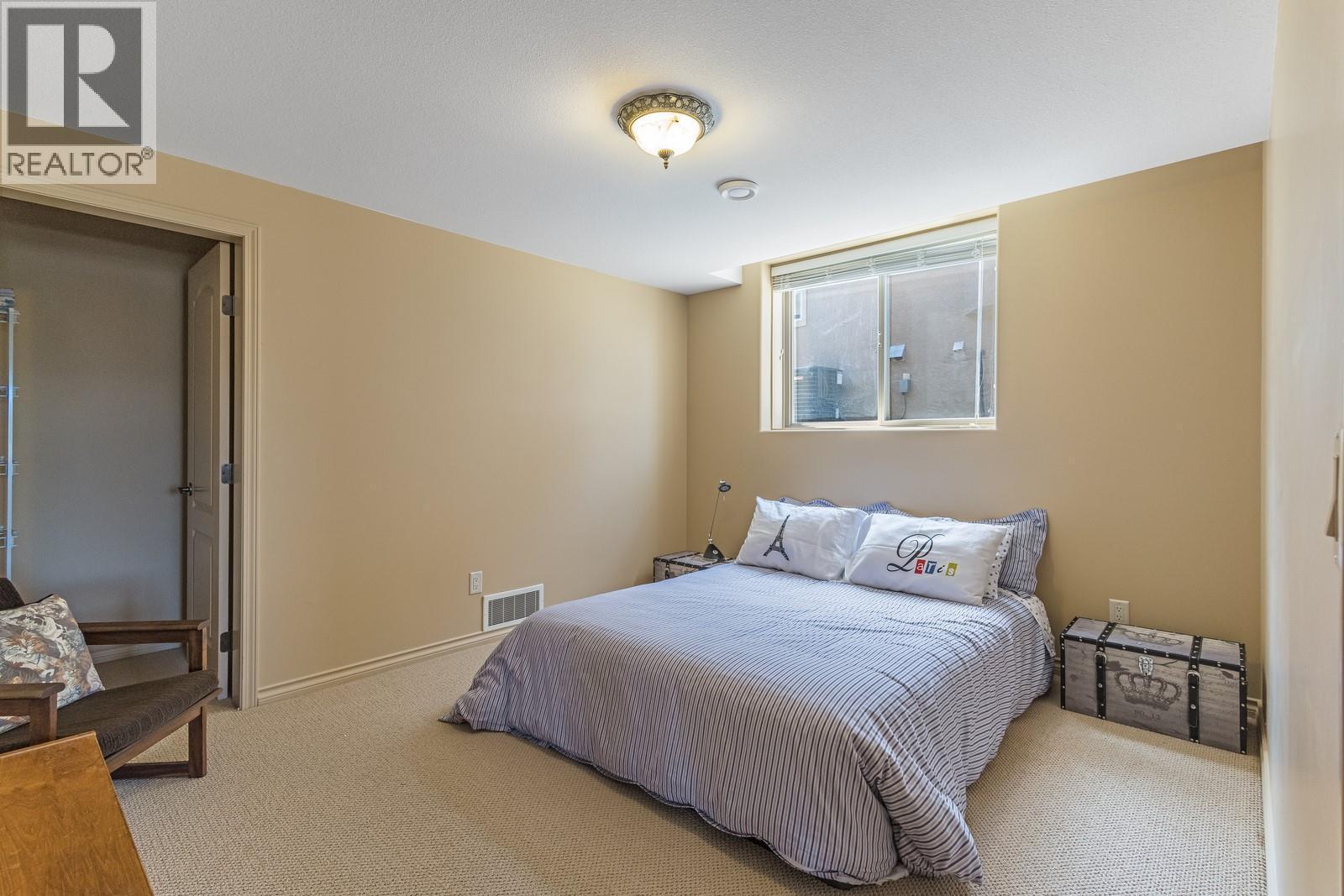 Lower level bedroom #4 - 610 Arrowleaf Lane, Kelowna, BC - Indoor Photo Showing Bedroom