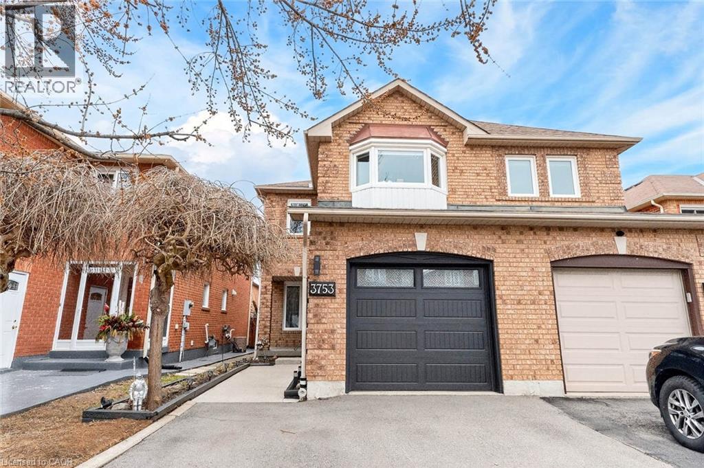 Traditional-style house with brick siding, driveway, and an attached garage - 3753 Densbury Drive, Mississauga, ON - Outdoor