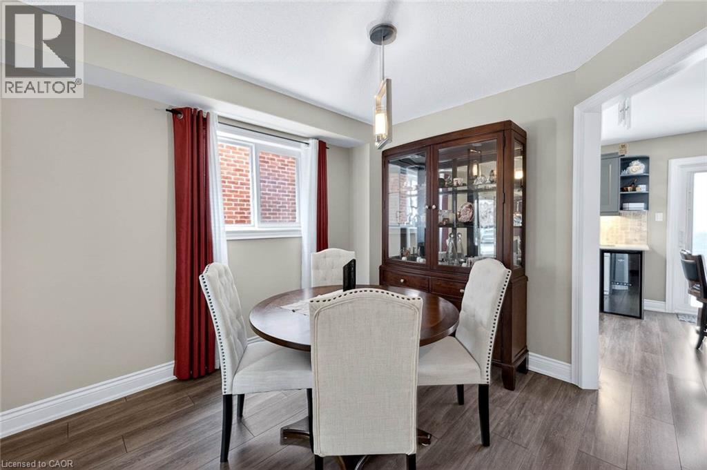 Dining room featuring dark wood-type flooring and beverage cooler - 3753 Densbury Drive, Mississauga, ON - Indoor Photo Showing Dining Room
