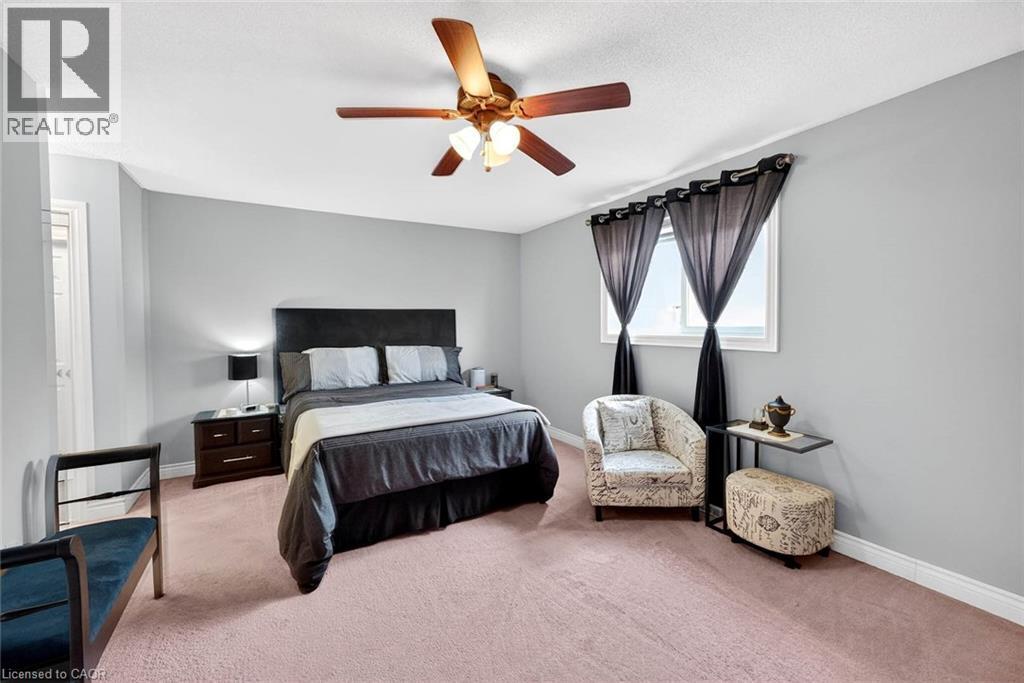 Carpeted bedroom with baseboards and a ceiling fan - 3753 Densbury Drive, Mississauga, ON - Indoor Photo Showing Bedroom