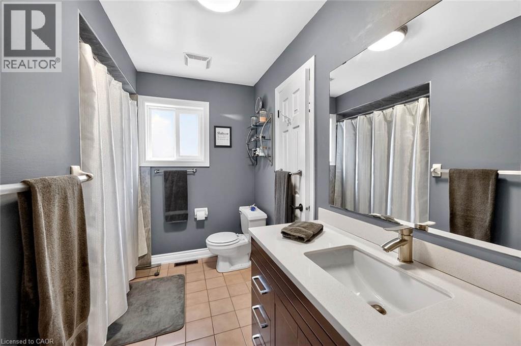 Bathroom featuring vanity, light tile patterned floors, and a shower with shower curtain - 3753 Densbury Drive, Mississauga, ON - Indoor Photo Showing Bathroom