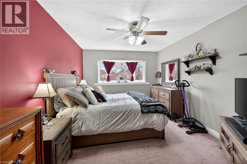 Bedroom featuring light carpet, a ceiling fan, and a textured ceiling - 3753 Densbury Drive, Mississauga, ON - Indoor Photo Showing Bedroom
