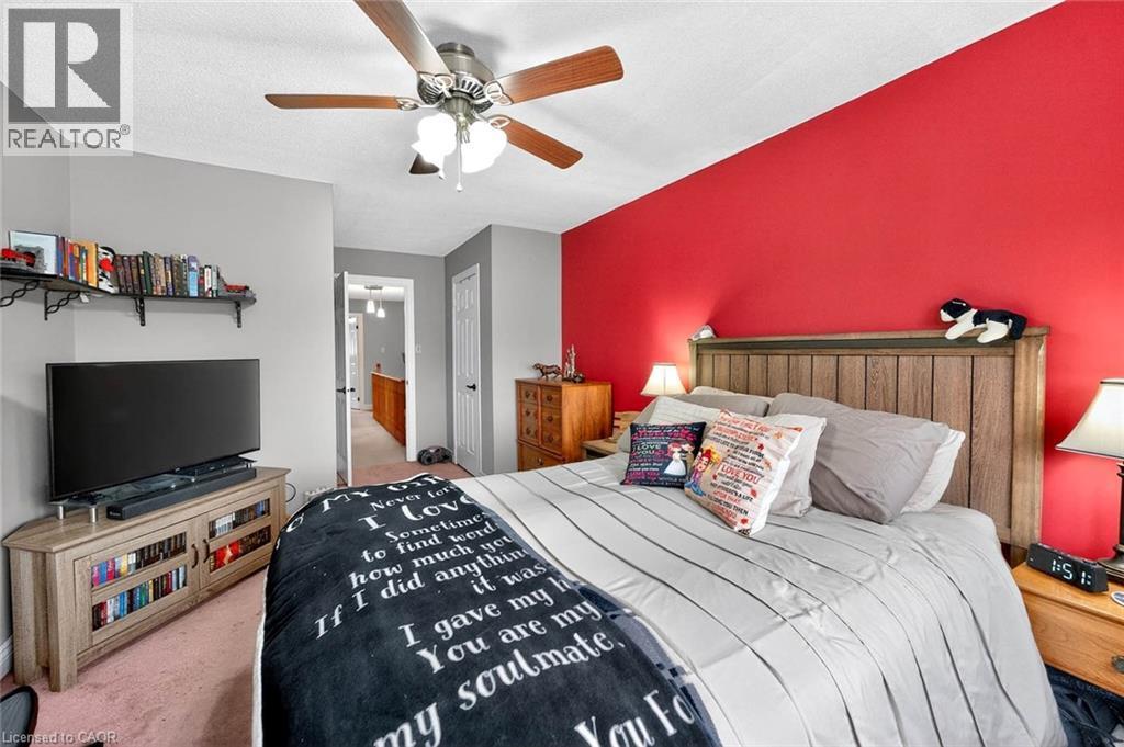 Bedroom featuring a closet, light colored carpet, and ceiling fan - 3753 Densbury Drive, Mississauga, ON - Indoor Photo Showing Bedroom