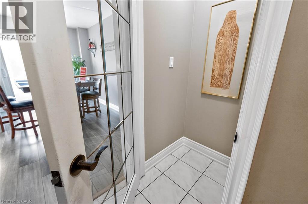 Corridor featuring light tile patterned floors and baseboards - 3753 Densbury Drive, Mississauga, ON - Indoor Photo Showing Other Room