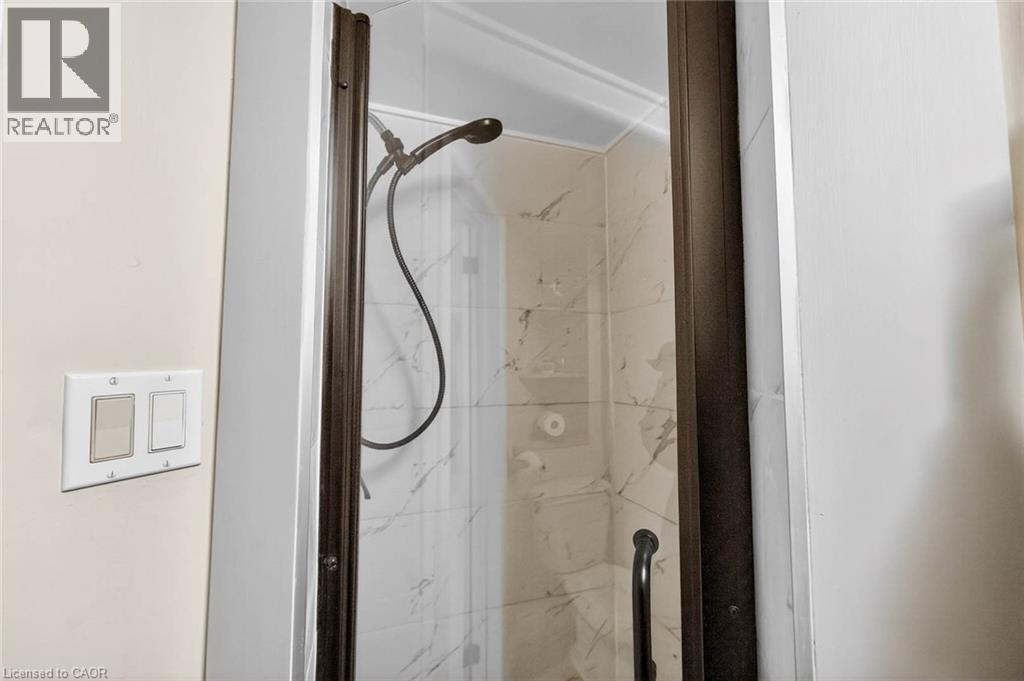 Bathroom view of a marble finish shower - 3753 Densbury Drive, Mississauga, ON - Indoor Photo Showing Bathroom