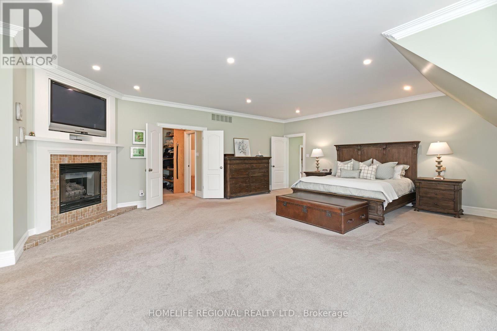 14 Buggey Lane, Ajax, ON - Indoor Photo Showing Bedroom With Fireplace