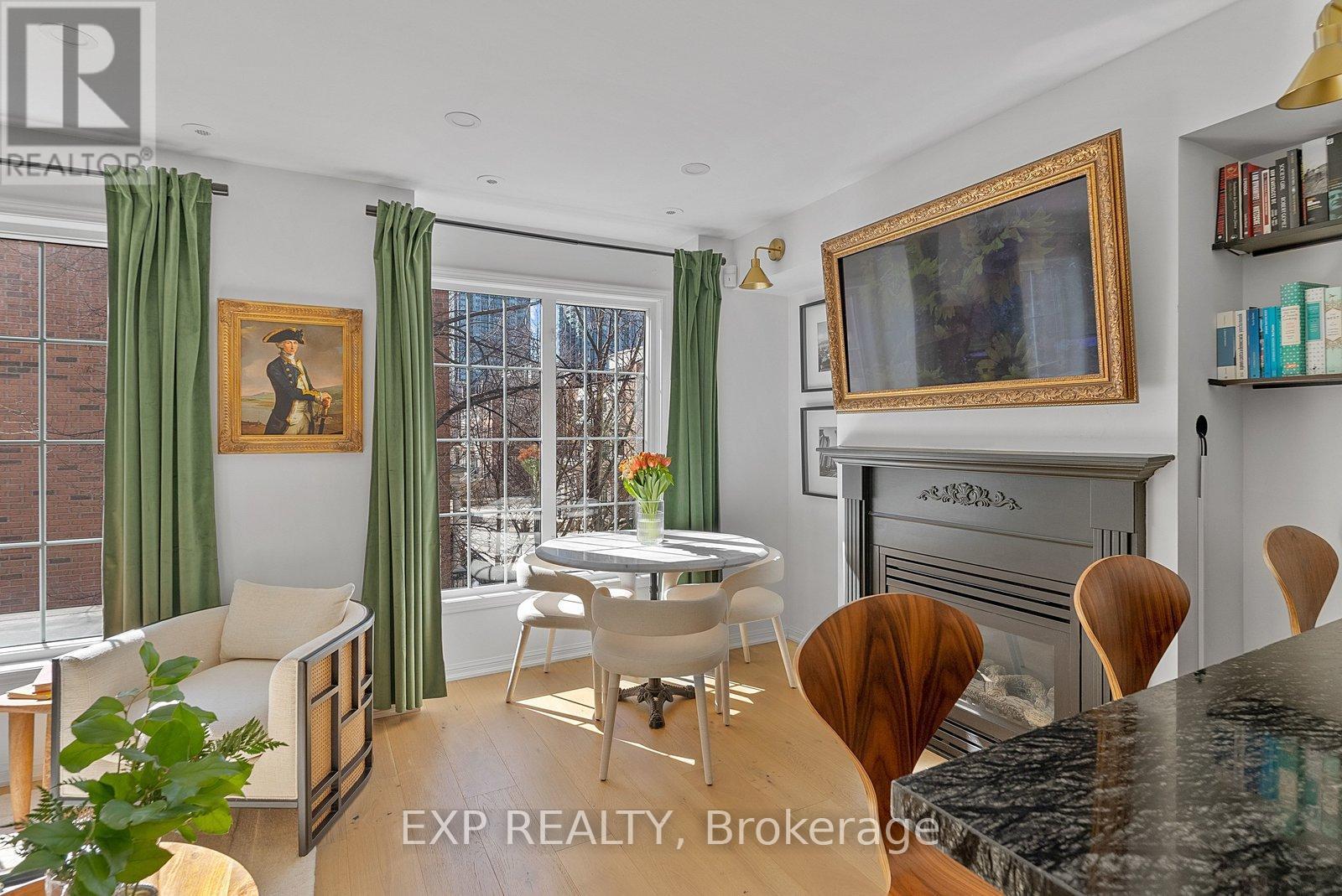 675 - 3 Everson Drive, Toronto, ON - Indoor Photo Showing Dining Room With Fireplace